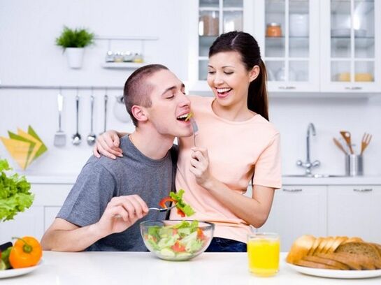 a woman feeds a man with products to naturally increase the potency